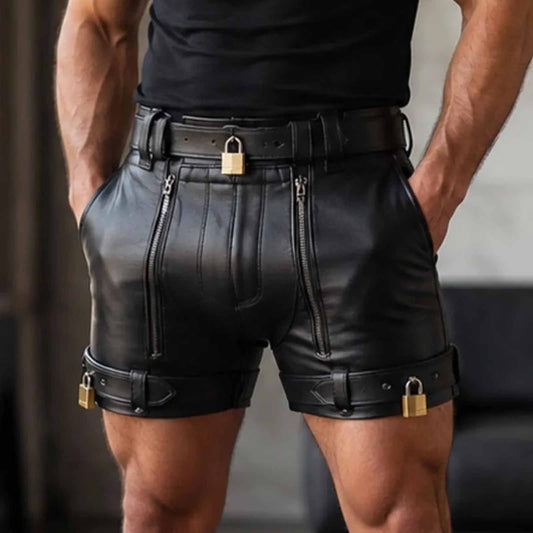 Front view close-up of a man wearing black real cowhide leather chastity shorts featuring dual front zips, a lockable waist belt, and lockable thigh straps with brass padlocks.