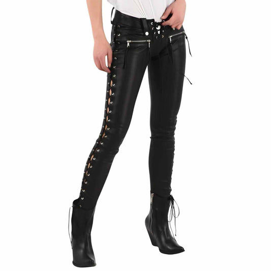 Front three quarter view of woman wearing handmade black lambskin leather skinny pants with side lace up eyelets and leather boots