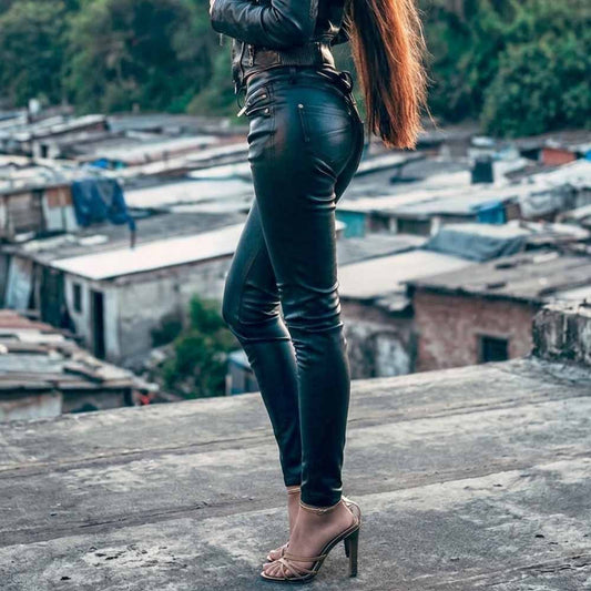 Side profile of woman wearing black real sheep nappa leather leggings paired with high heels