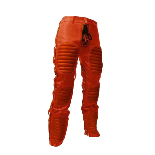 Bright orange protective leather pants with integrated padded panels on the thighs and calves, side lacing, and a black drawstring at the waist, shown against a plain white background.