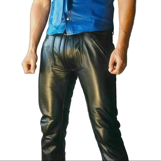 A man wearing a blue leather blazer and black leather pants with a double-breasted zipper.