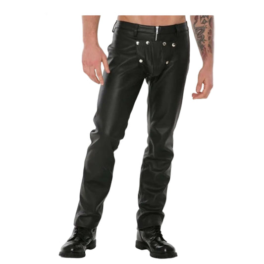 A man wearing black real leather bikers pants with a detachable front codpiece, standing against a white background.