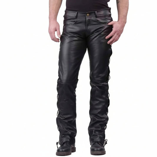 Black leather motorcycle chaps with a skull and 'Real Leather' logo patch on the lower left leg, shown on a model against a white background.