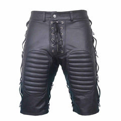 Front view of men's black cowhide leather bondage shorts featuring padded thigh panels, lace-up zip fly, and side D-ring straps.
