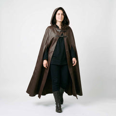Full front shot of woman wearing brown genuine leather hooded cloak showing ankle length sweep and dual chest roller buckles