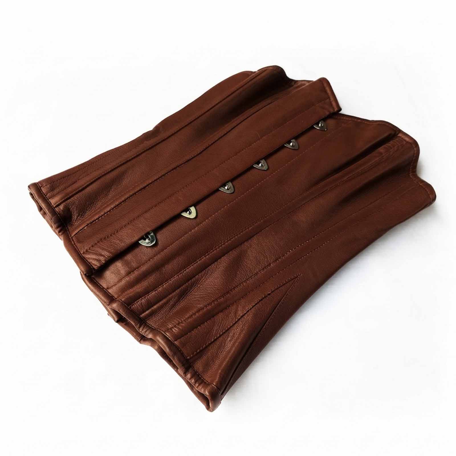 Flat lay view showcasing the smooth grain texture of the brown sheepskin leather overbust corset folded flat.