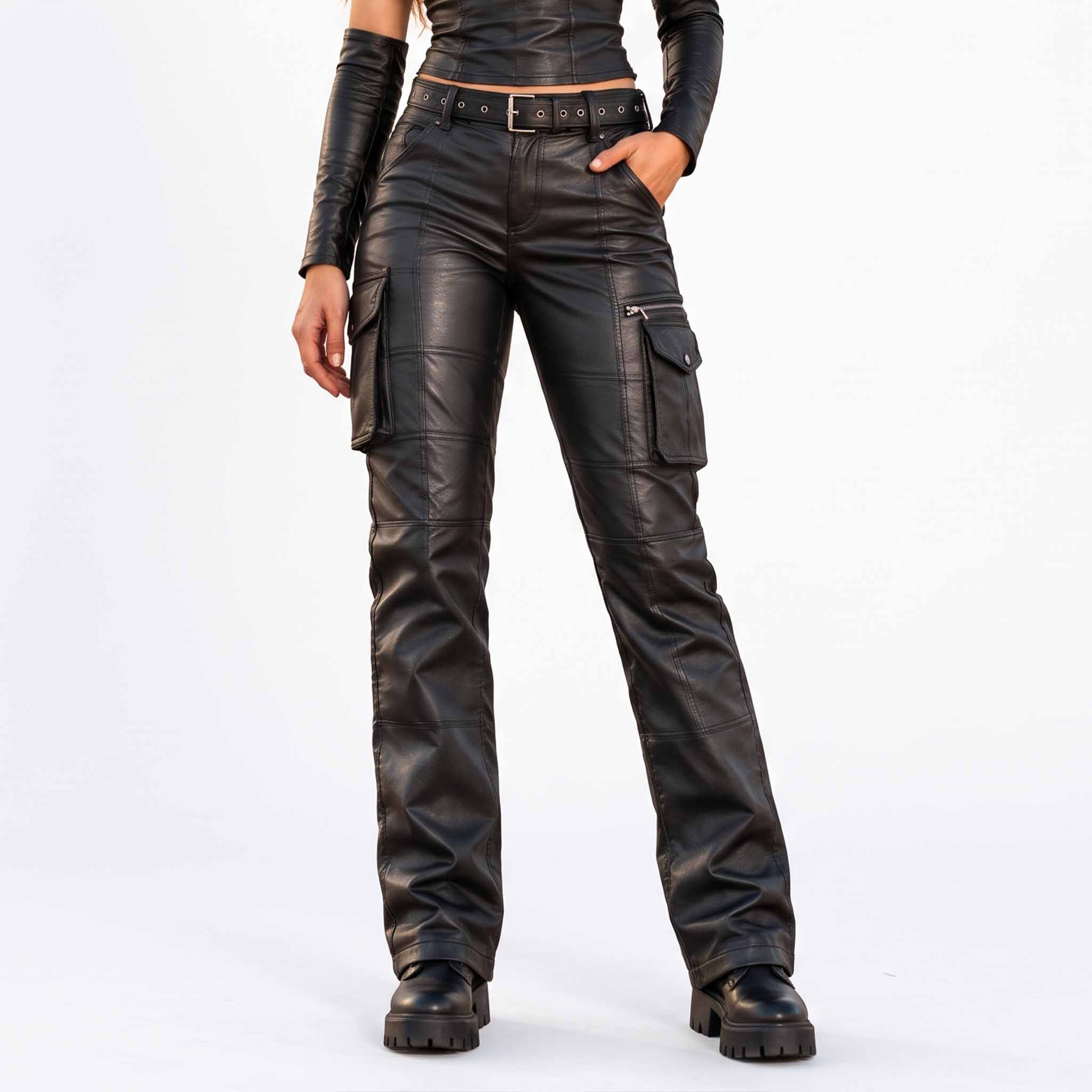 Front view of a woman wearing black sheepskin leather cargo pants with utility side pockets and chunky lug sole boots