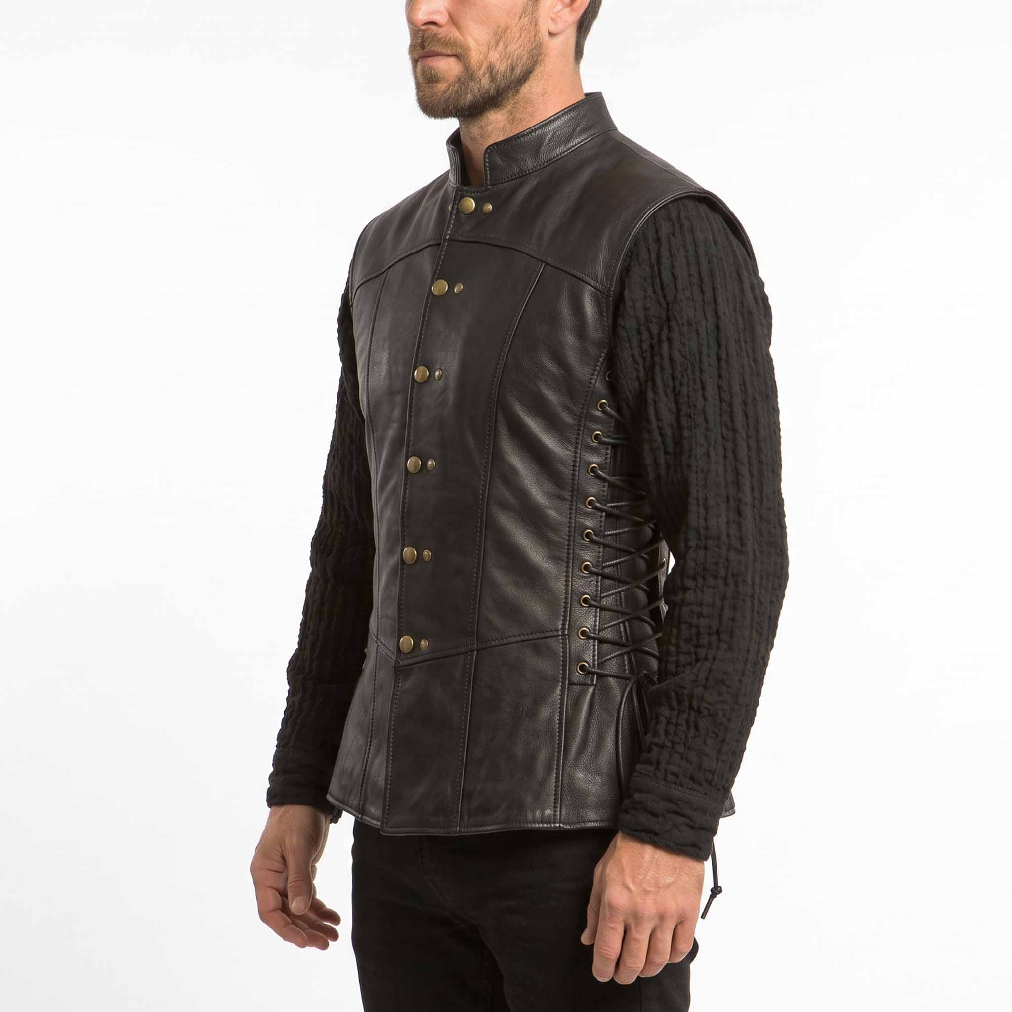 Three-quarter front angle showcasing the stand collar, brass snap closures, and side lace construction on the black handmade armor doublet.