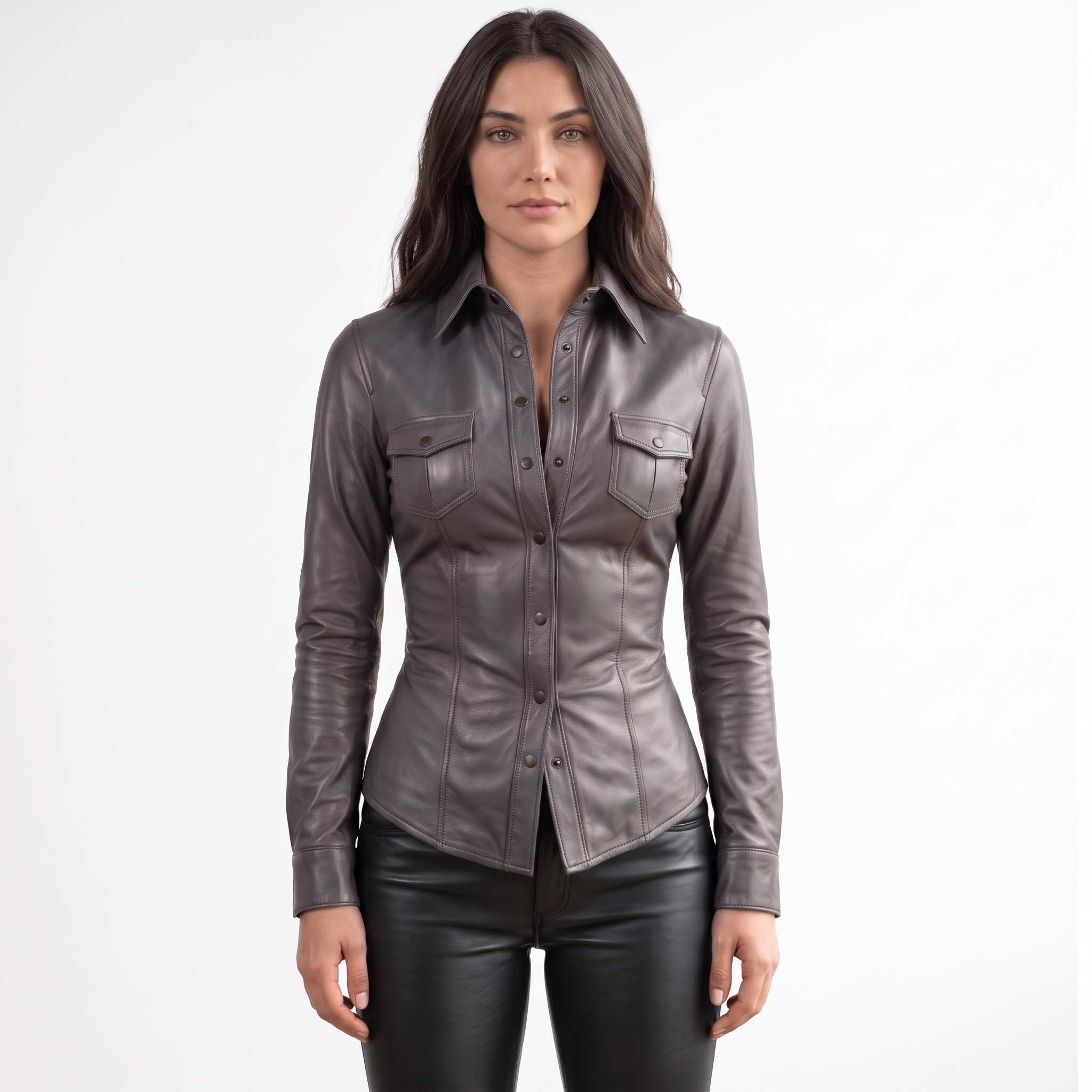 Full front view of a brunette model posing in a fitted dark gray lambskin leather button down shirt paired with black pants.