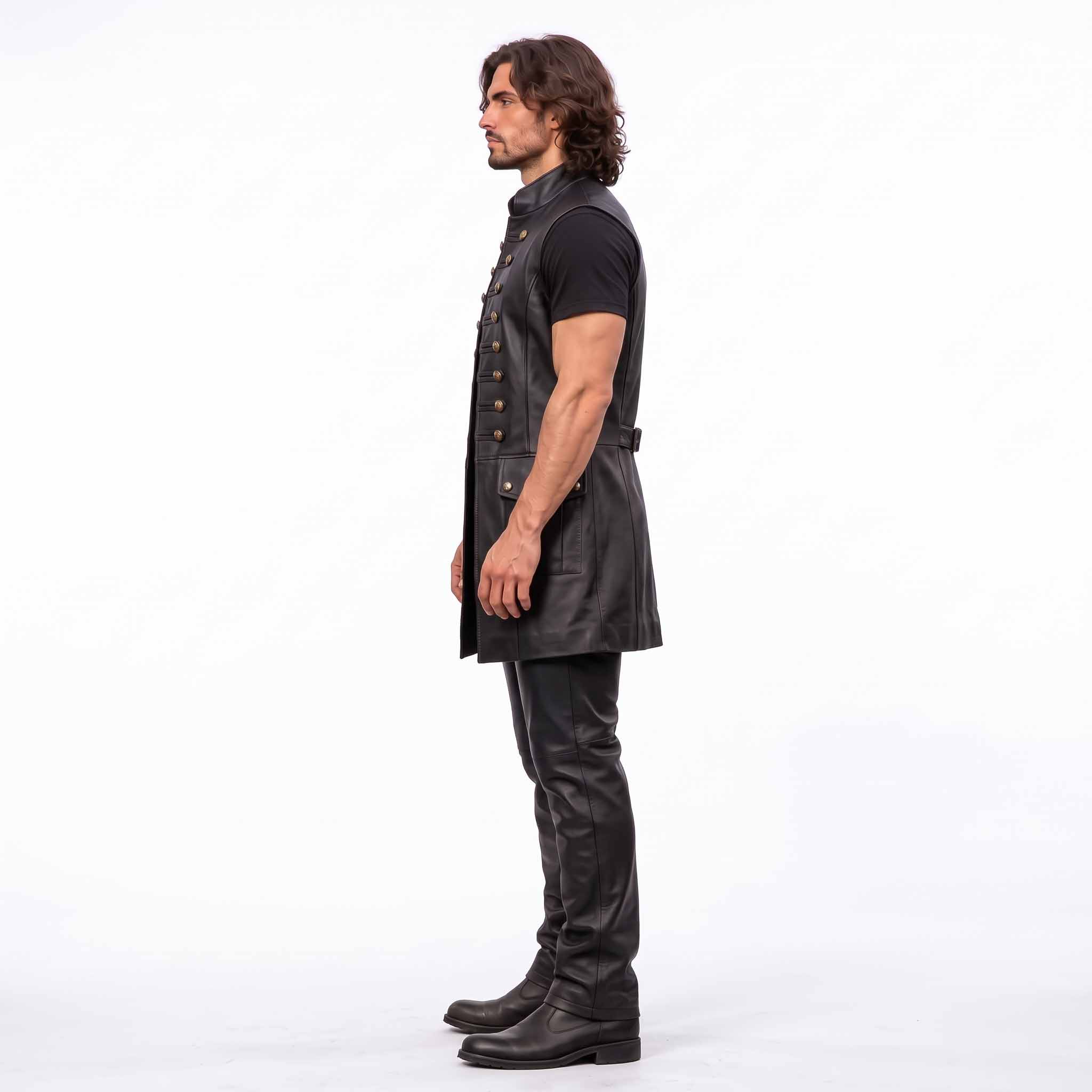 Side profile 90 degree view of man wearing tailored long black leather medieval waistcoat showing armhole cut and flap pocket