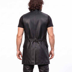 Rear upper torso view of man wearing black leather medieval vest showing back waist strap and clean vertical seams