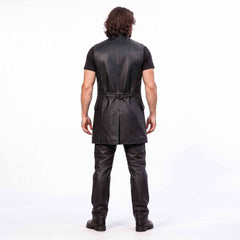 Full length back view of man wearing black genuine leather long vest showing back cinch belt and center split walking vent