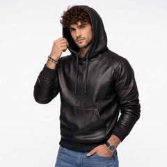 Front three quarter perspective of man modeling black leather streetwear pullover hoodie adjusting the leather hood