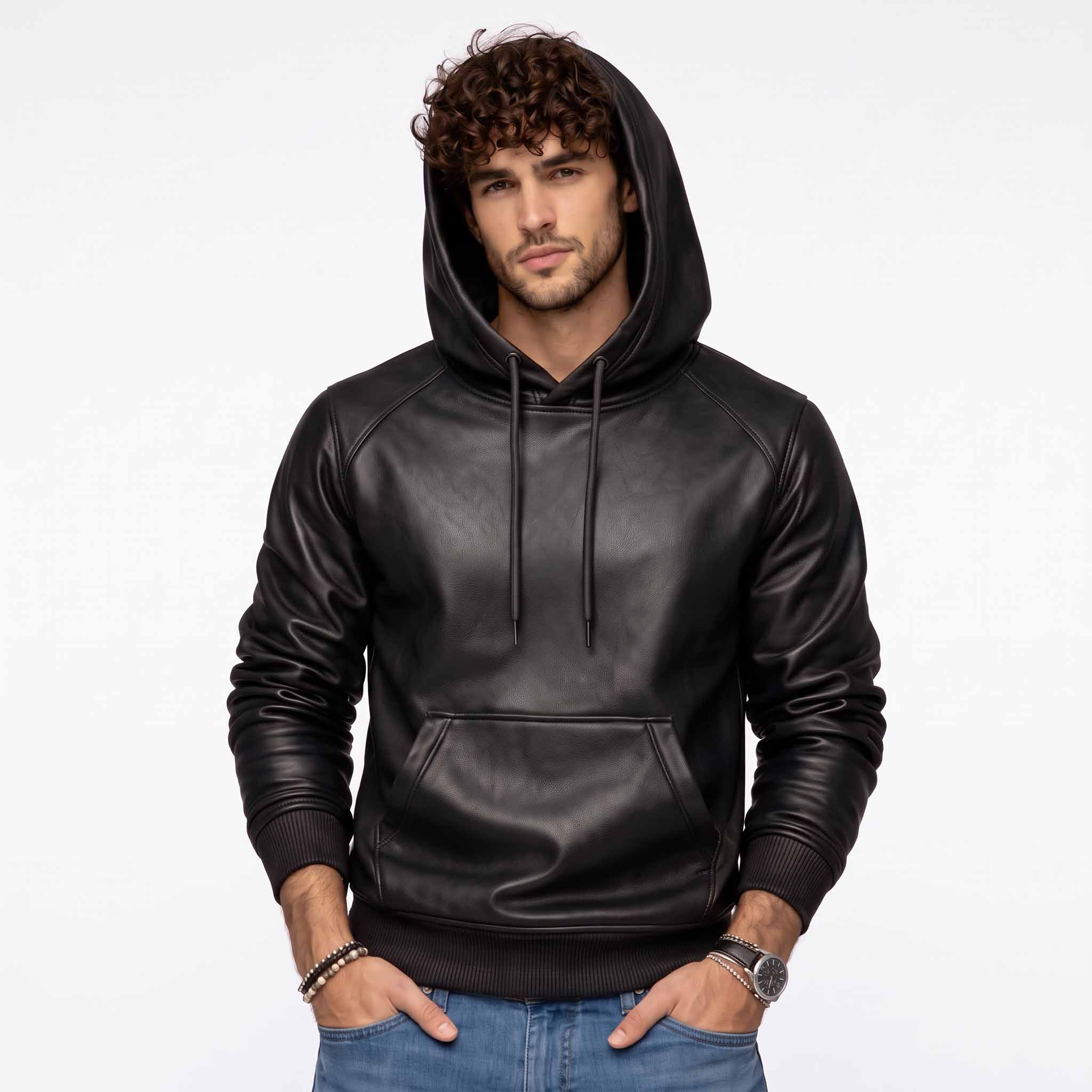 Full front shot of handsome curly haired man wearing handmade black sheepskin leather hoodie with hood up and hands in pockets