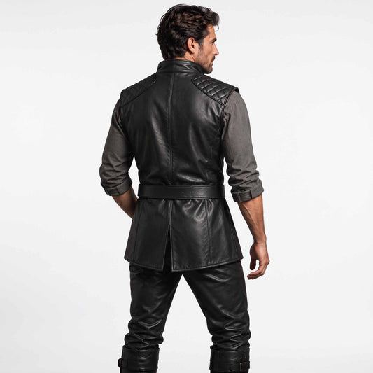 Back view of man modeling black leather renaissance vest displaying diamond quilted shoulder panels, center spine seam, and split hem