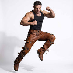 Mid air athletic jump pose of man wearing brown leather gothic trousers demonstrating leg flexibility and durable seam construction