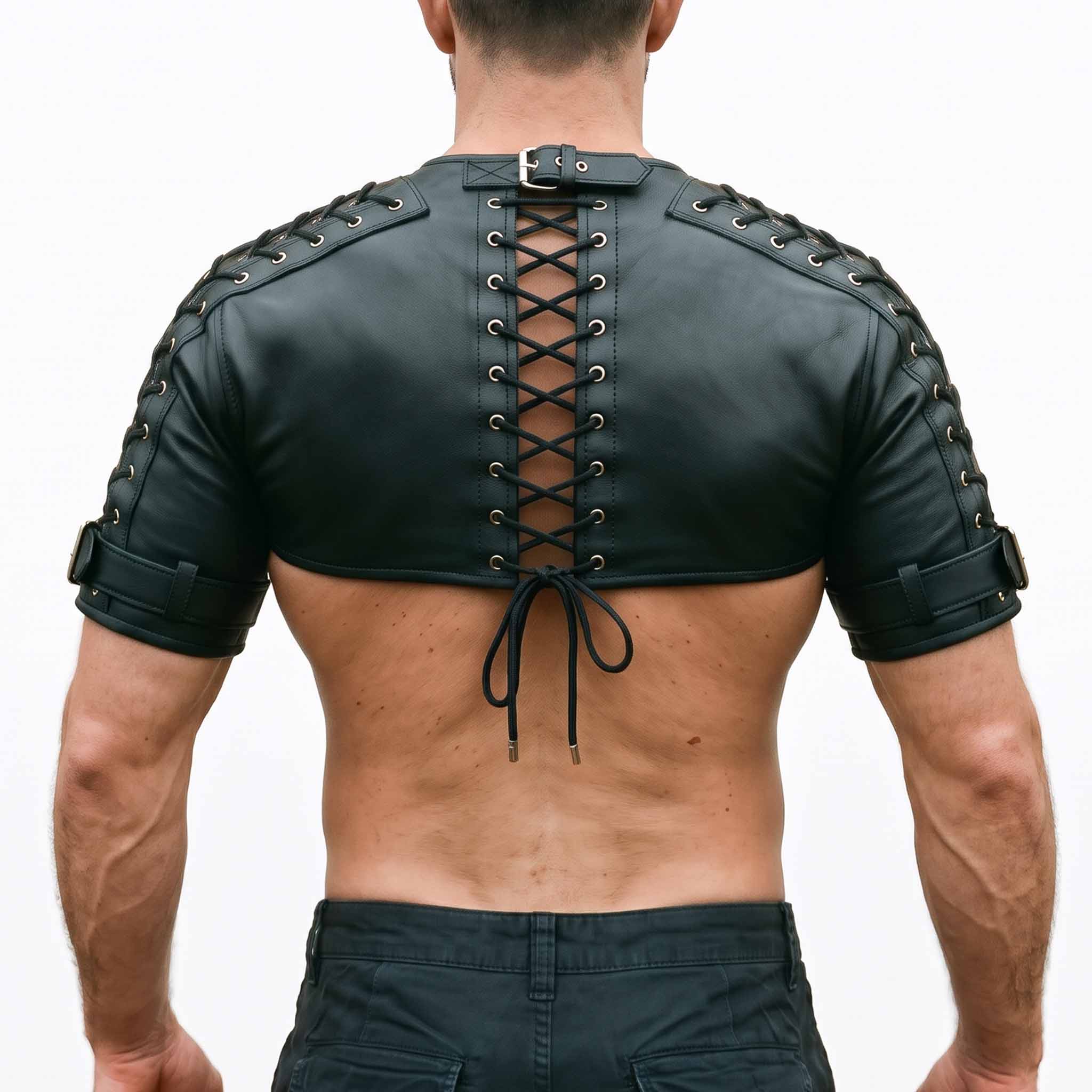 Direct back view of muscular man wearing black leather festival shrug showing spine corset lacing and bicep buckle straps