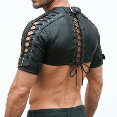 Rear three-quarter perspective of male model wearing black genuine leather half-shirt harness highlighting shoulder and back lacing