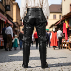 Back view of a man wearing handcrafted black leather Steampunk breeches walking through an outdoor historical festival market.