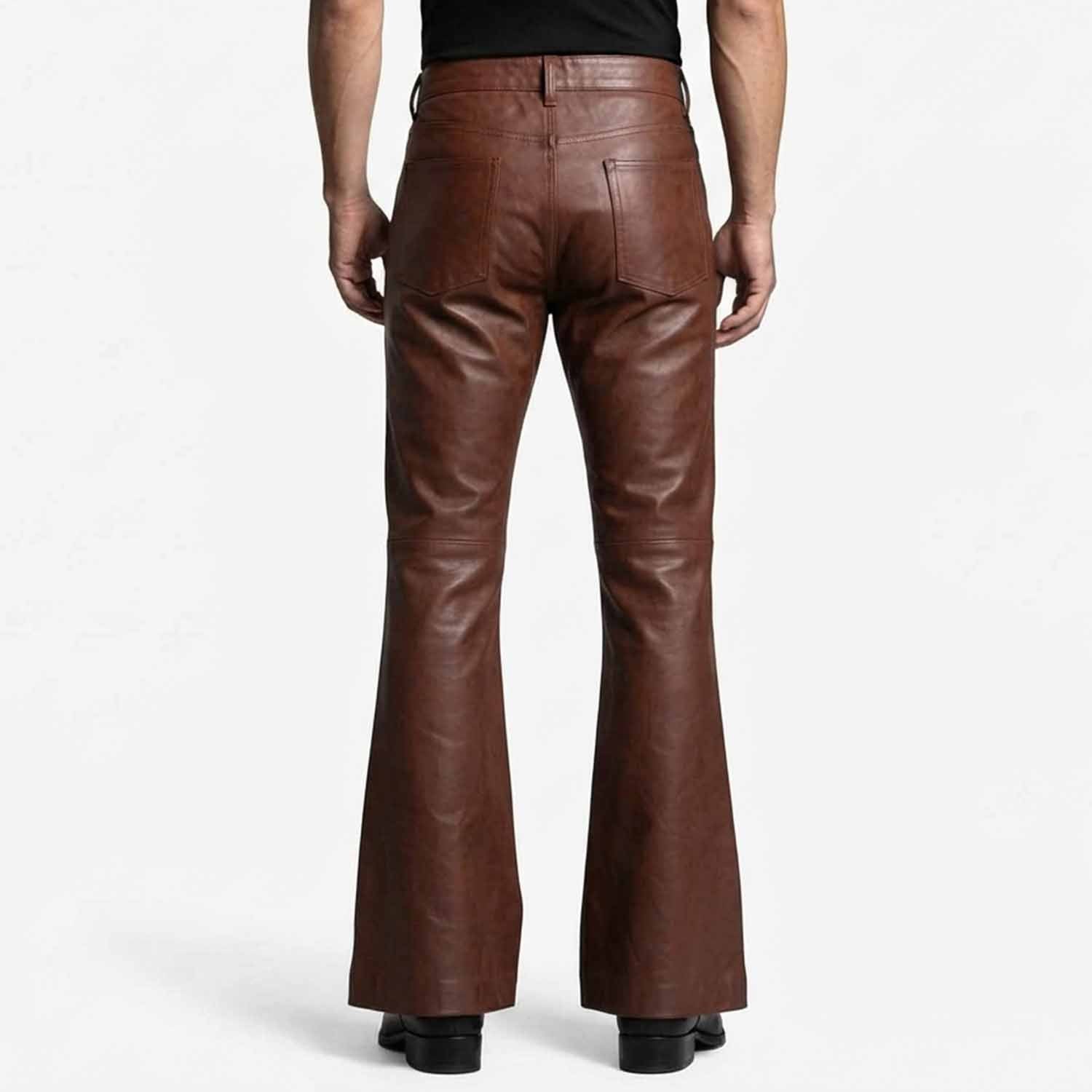 Rear view showcasing the clean back pockets, high waist cut, and wide flared leg opening on black leather trousers.