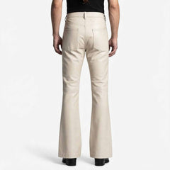 Rear view showcasing the clean back pockets, high waist cut, and wide flared leg opening on black leather trousers.
