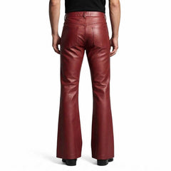 Rear view showcasing the clean back pockets, high waist cut, and wide flared leg opening on black leather trousers.