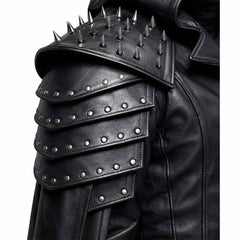 Close-up shot of the genuine black leather shoulder armor with rows of metal rivets and sharp decorative spikes.