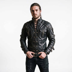 Full length front studio portrait of bearded man wearing handmade black leather gothic doublet jacket paired with distressed black jeans on white background