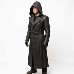 Front three quarter perspective of male model wearing long black leather gothic duster coat showing deep cowl hood and side waist pockets