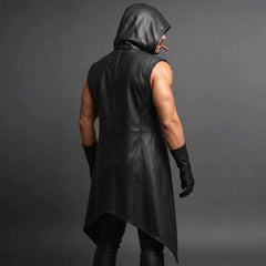 Rear three quarter studio angle showing draped leather cowl hood and asymmetric lower hem on sleeveless cyberpunk duster coat