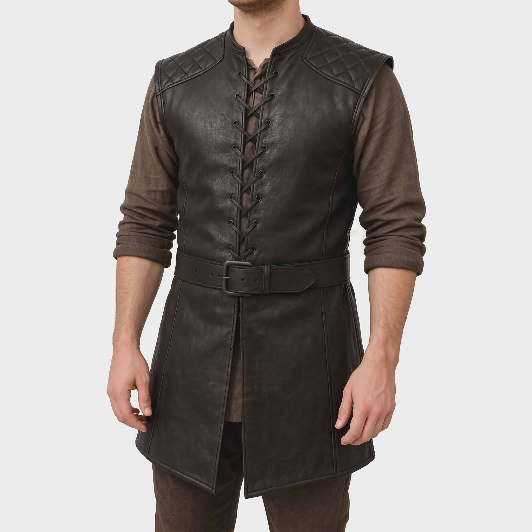 Front three quarter crop of man wearing handmade black leather long medieval vest with eyelet cord lacing, quilted shoulders, and buckled waist belt