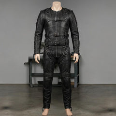 Front view of mens black leather restraint suit on tailor mannequin inside craft workshop highlighting heavy duty zippers and front roller buckles