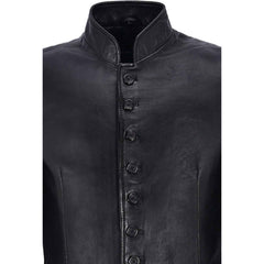 Close-up view of the double-stitched panel seams and flared hem section on a men's black leather gothic duster.