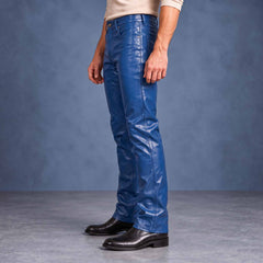 Side profile showcasing the clean thigh fit and bootcut hem drape of men's handcrafted blue genuine leather trousers