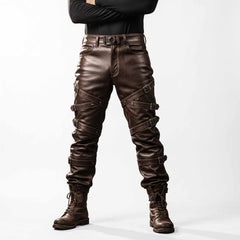 Full length front studio shot of man wearing handmade brown cowhide leather pants with wrap around buckle straps and combat boots on white background