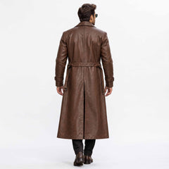 Back full length studio view of mens brown leather duster coat showing tailored vertical back seams and deep center split walking vent