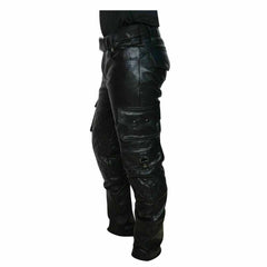 Side profile view of men's black cowhide leather cargo trousers displaying stacked snap-flap pockets and diamond-quilted knee panels.