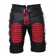 Front view of men's black cowhide leather bondage shorts featuring red padded thigh panels, red lace-up zip fly, and side D-ring straps.