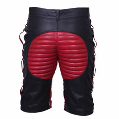 Back view of men's contrast leather clubwear shorts showing red padded seat panel, belt loops, and side steel D-ring leg attachments.