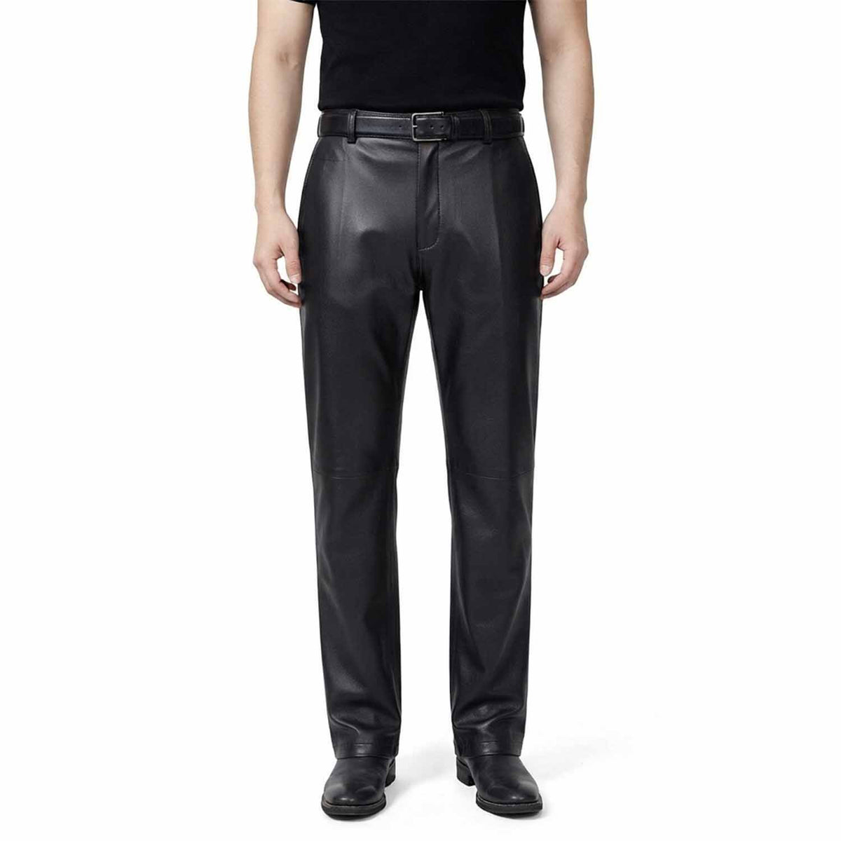 Full-length front view of a man wearing classic-fit blsck leather formal trousers with a smooth finish and straight leg.