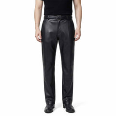 Full-length front view of a man wearing classic-fit blsck leather formal trousers with a smooth finish and straight leg.