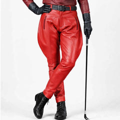 Vibrant red genuine leather equestrian riding pants highlighting the relaxed thigh profile and tapered lower leg.