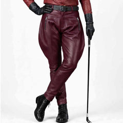 Burgundy genuine leather equestrian trousers highlighting smooth craftsmanship and metal detailing.
