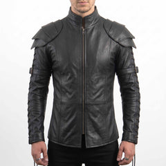 Front torso shot of male model wearing handmade gothic black cowhide leather armor shirt with center zip, tiered shoulder pauldrons, and lace-up sleeves