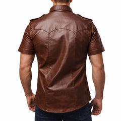 Rear view showing the tailored back yoke and vertical panel stitching on a men's brown short sleeve leather shirt.