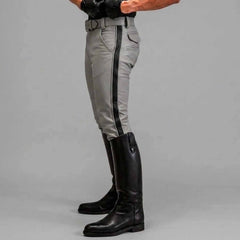 Side profile view highlighting the slim tapered leg, mid-rise fit, and striking vertical white stripe detail of the leather breeches.