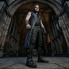 Low-angle perspective of man in medieval castle courtyard wearing long black leather armor vest open over combat cargo trousers and boots