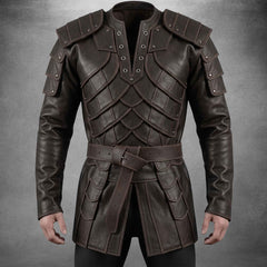 Front view of a men's dark brown leather medieval armor coat showcasing layered scale chest plates, riveted tiered shoulder pauldrons, and a matching buckle waist belt.