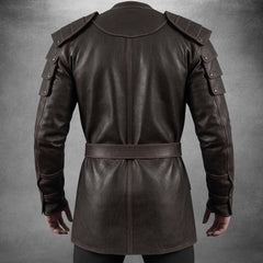 Rear view of the dark brown handmade leather warrior coat highlighting the contoured upper yoke, reinforced arm pauldrons, and smooth split-drape hem.