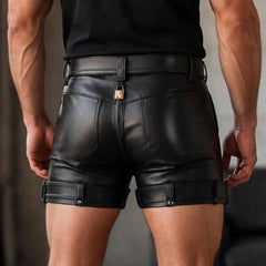 Rear view close-up showing the full-length back zipper, rear pocket detailing, and fitted seat of men's black leather chastity shorts.